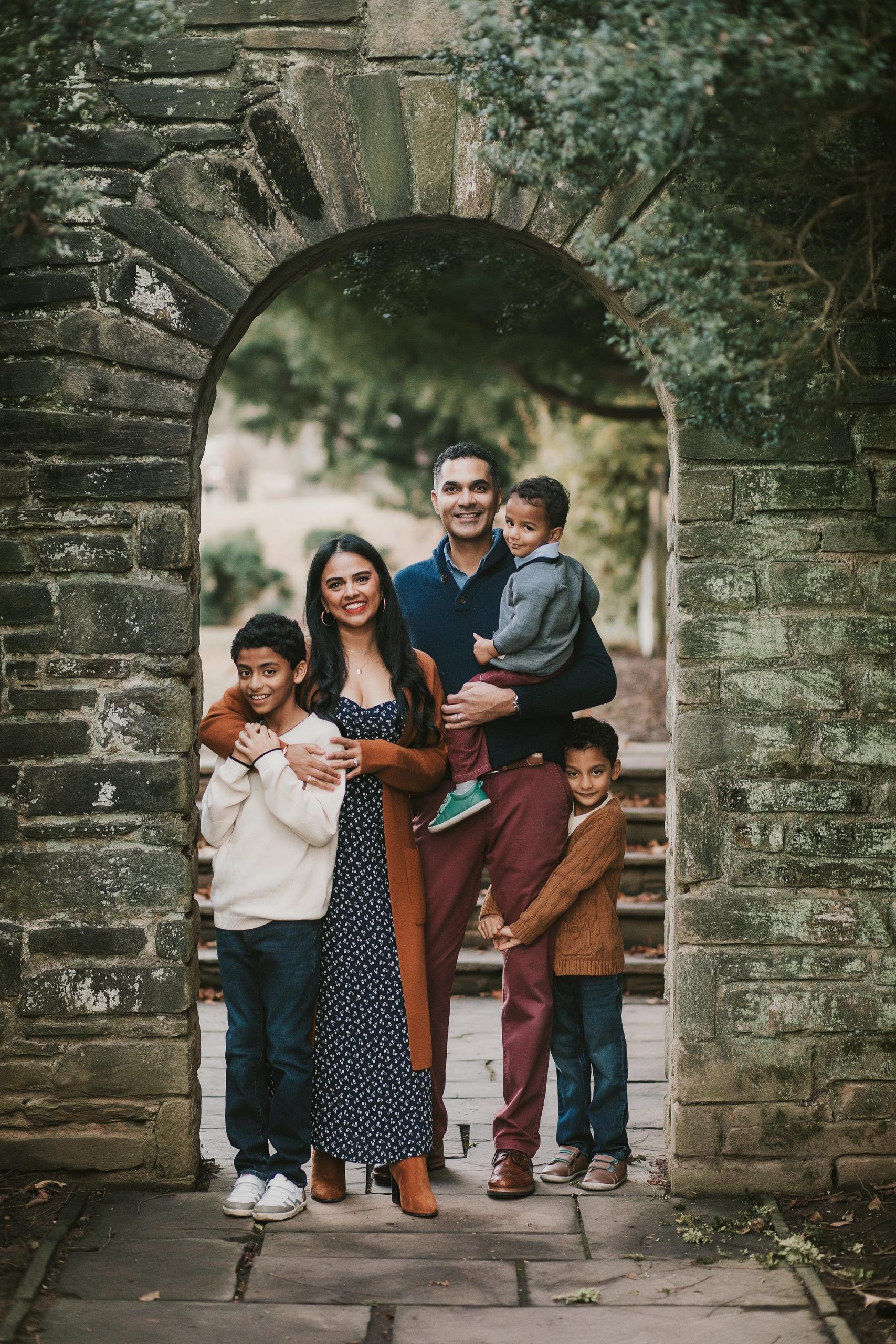 family of five under archway