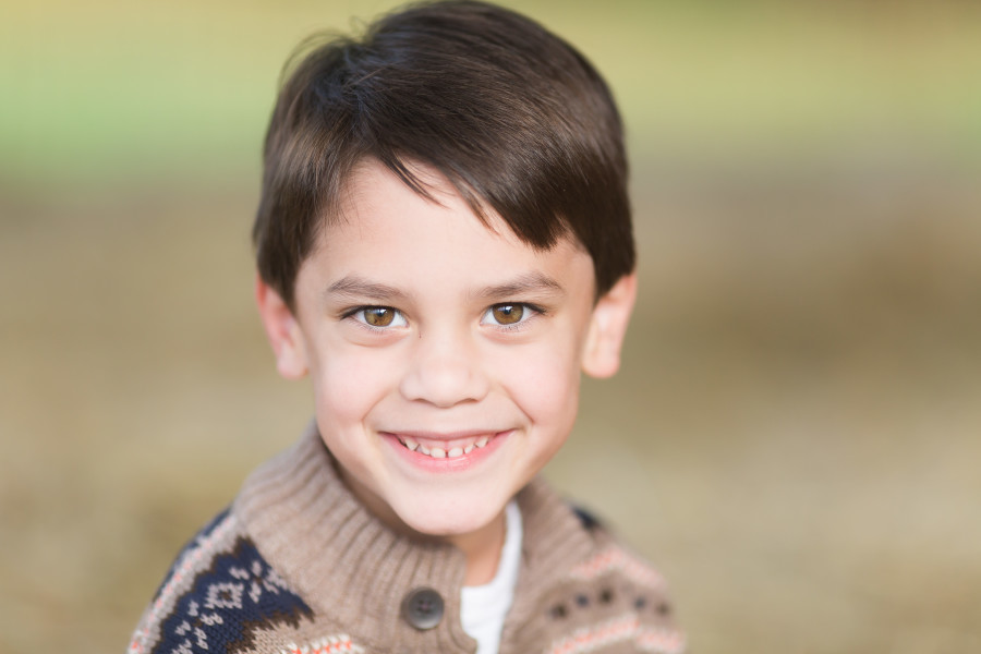 close up of beautiful boy with big brown eyes