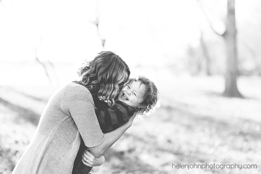 Black and white photo of mom and son hugging