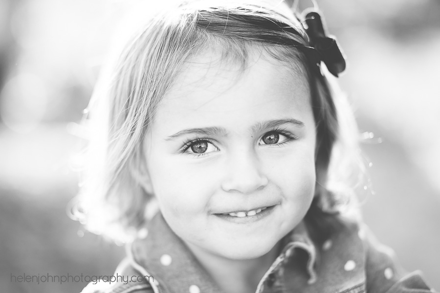 Black and white photo of little girl smiling