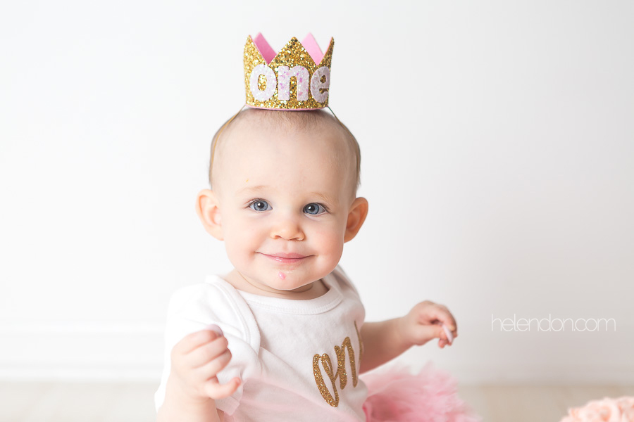 smiling baby girl wearing crown