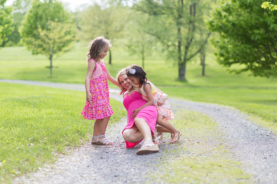 two daughters making mom fall over