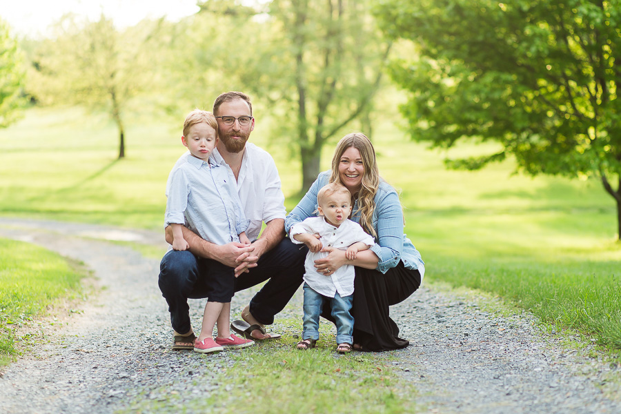 two litlte boys making funny faces in family portrait