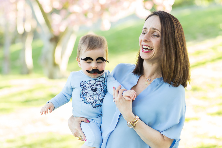 baby with stick on eyebrows and mustache