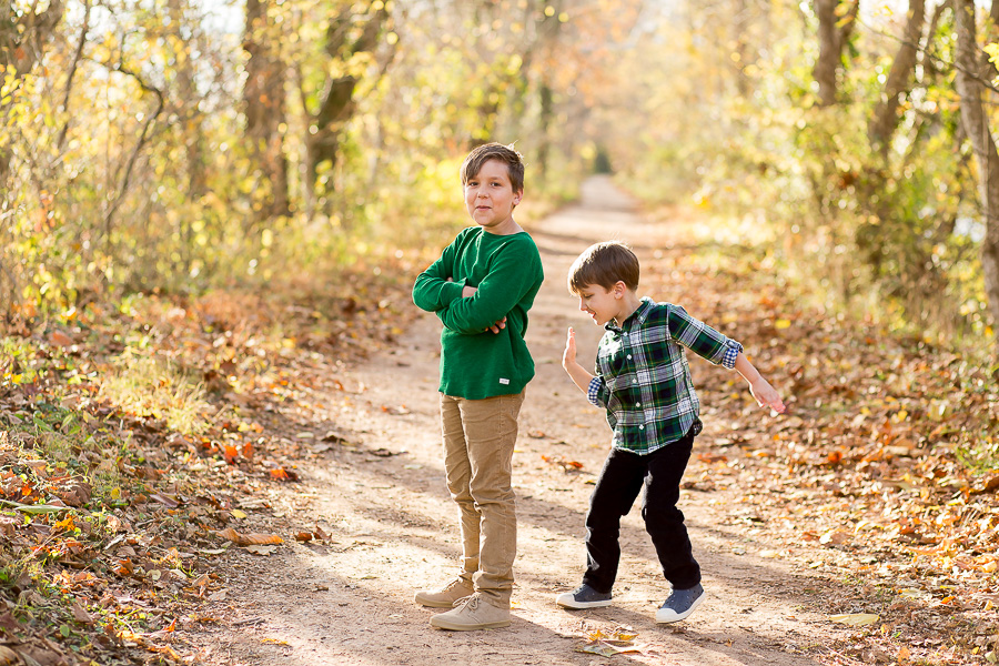 little brother slapping big brother's bottom