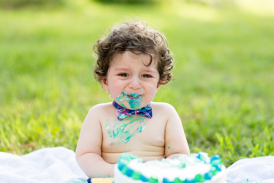 1 year old crying with cake on face