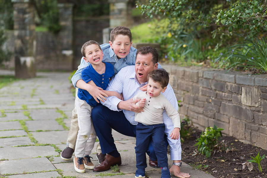 three sons making dad fall over