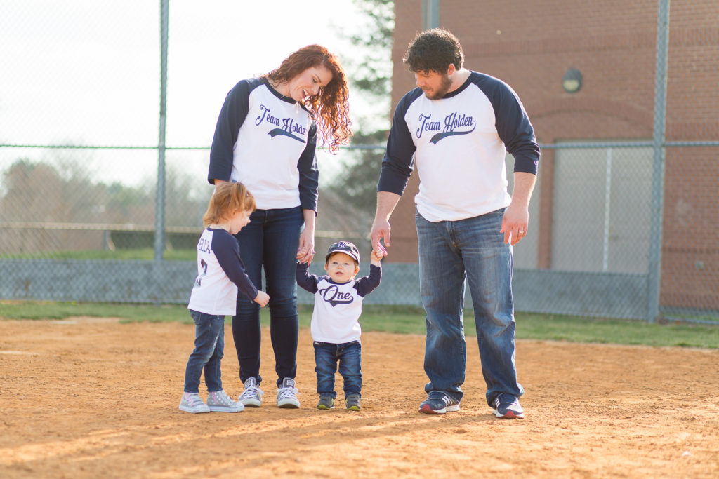 family looking at baby