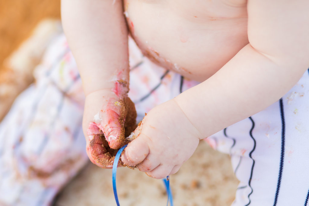 close up of 1 year old dirty hands