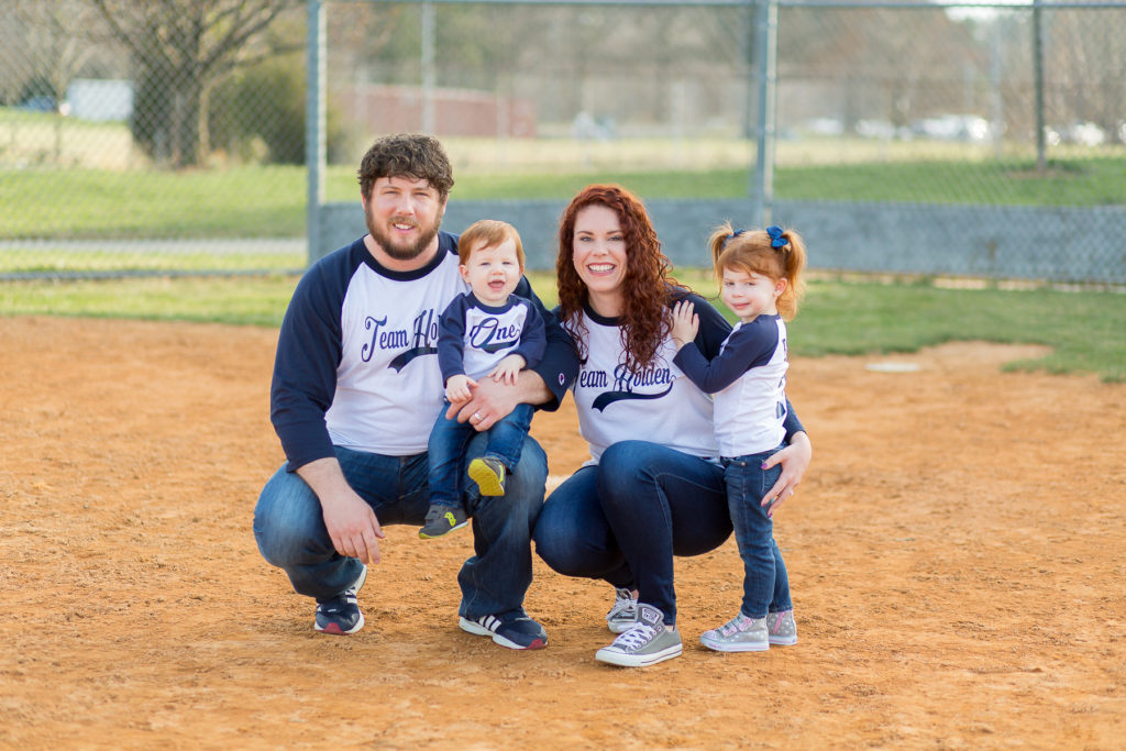 family of four in baseball shirts