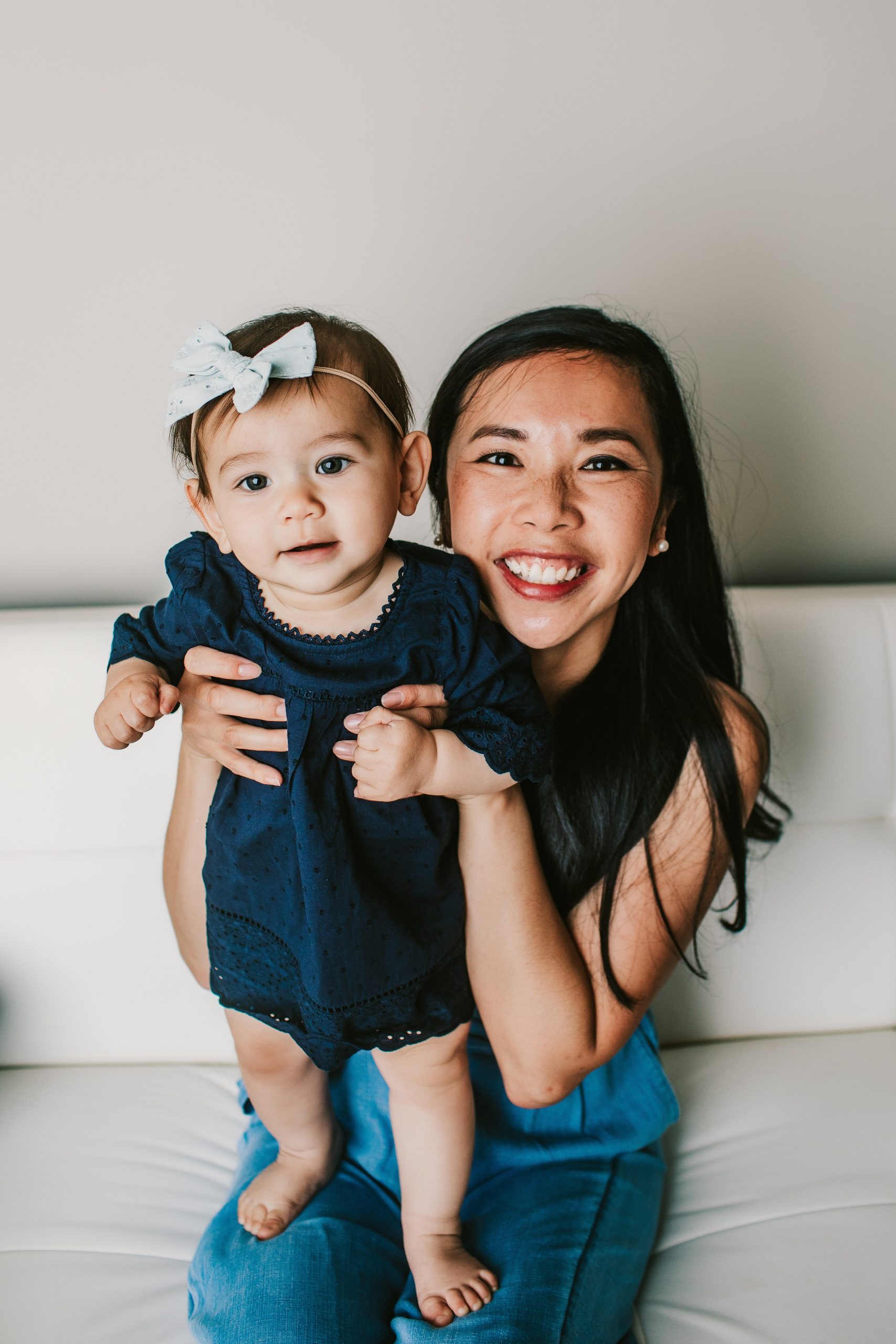 mother holding one year old daughter