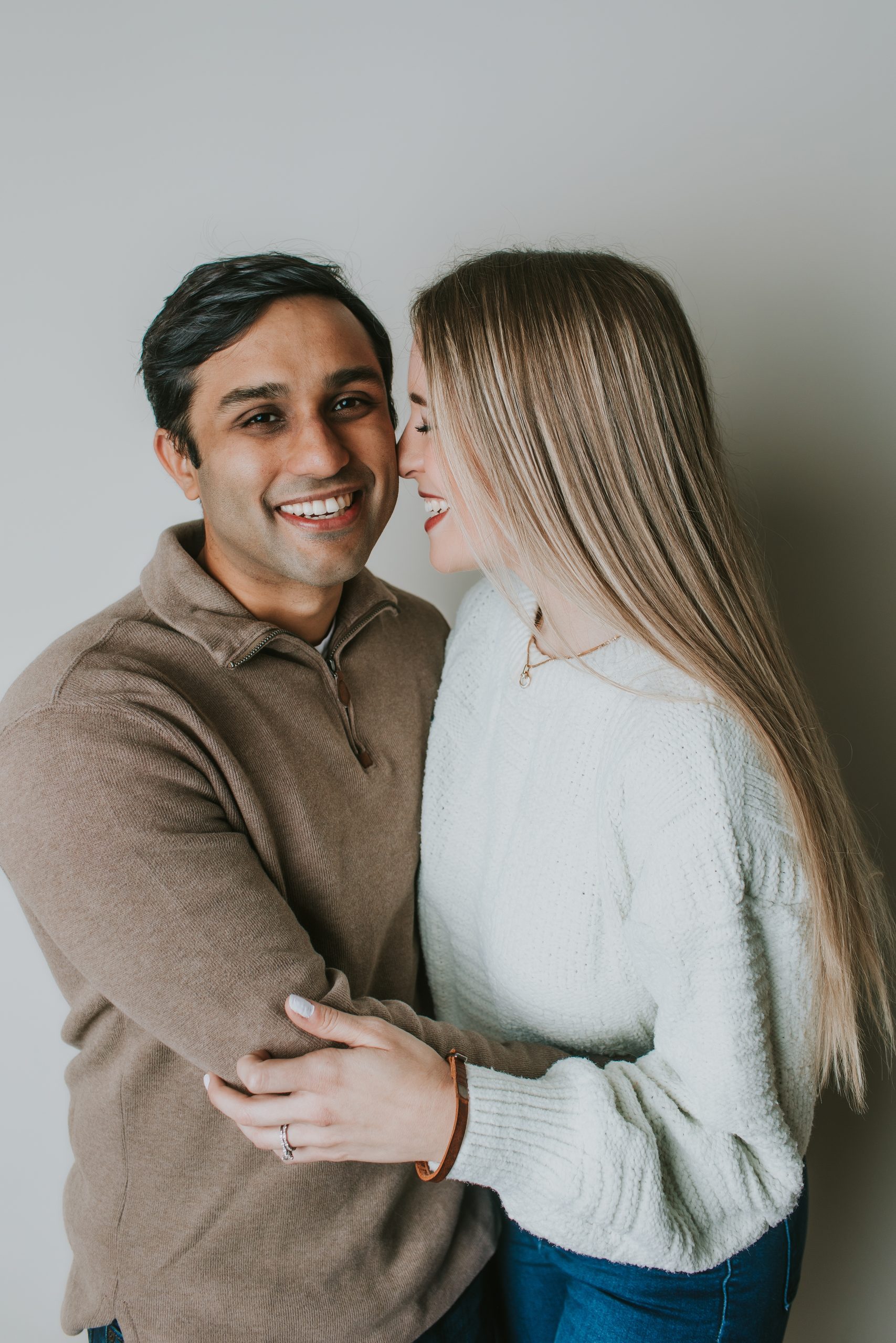 engagement photo of young couple in studio