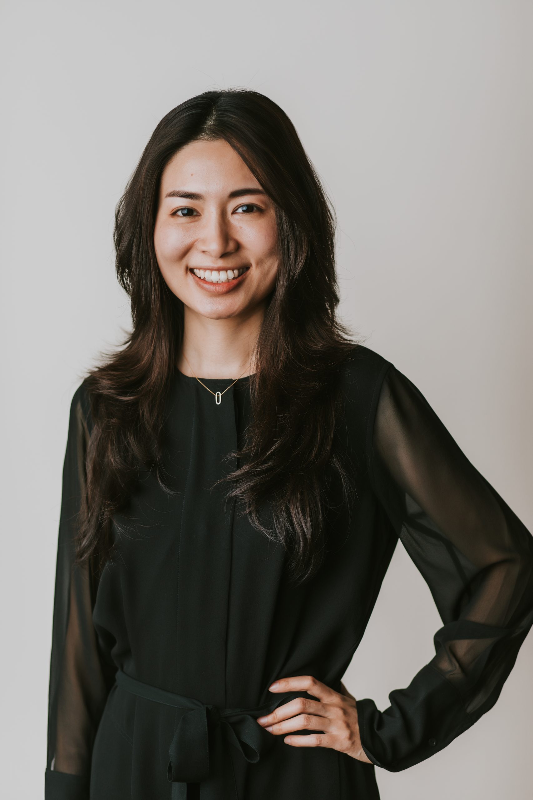 woman in block sheer top headshot