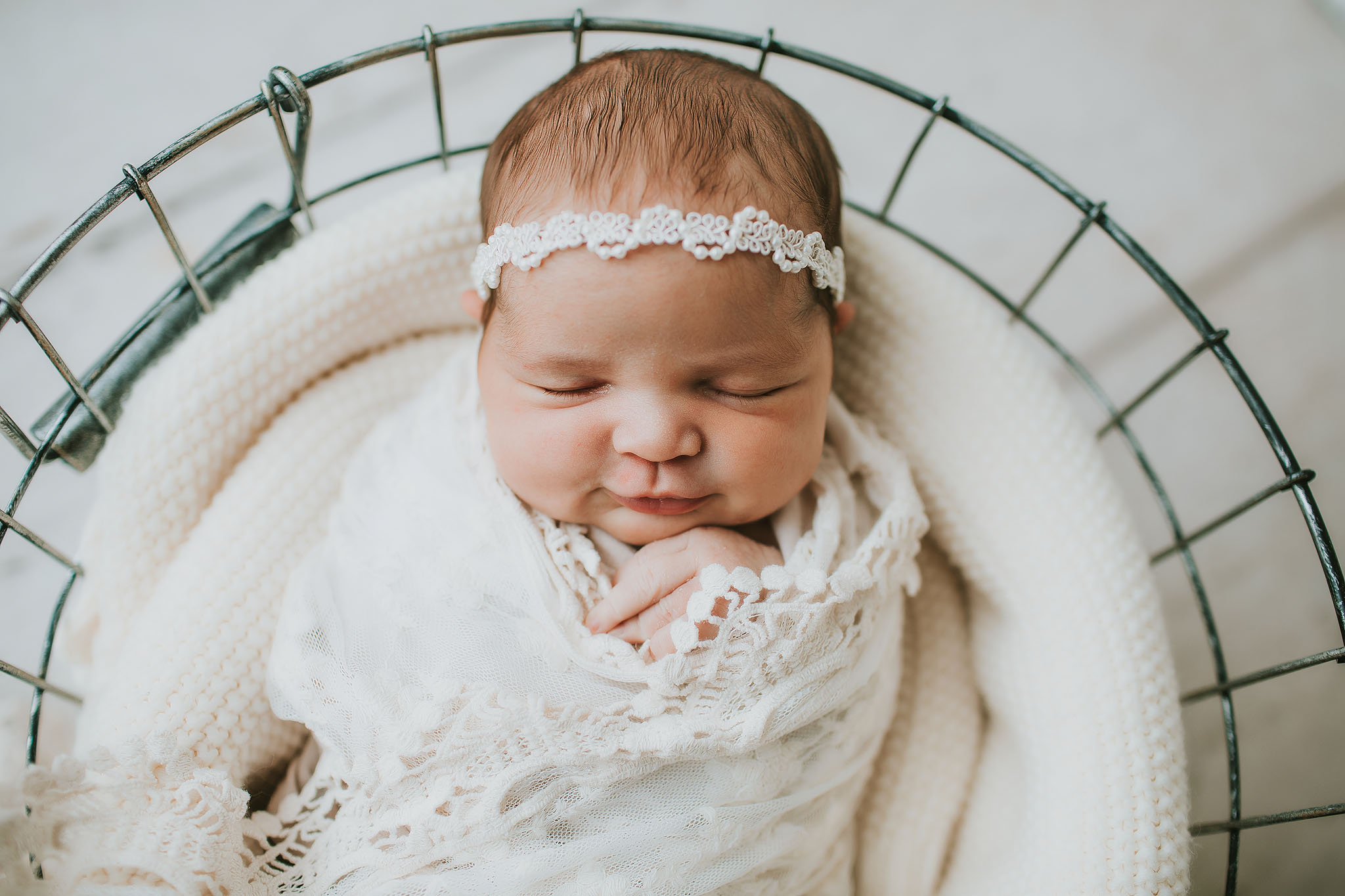 newborn baby girl smiling