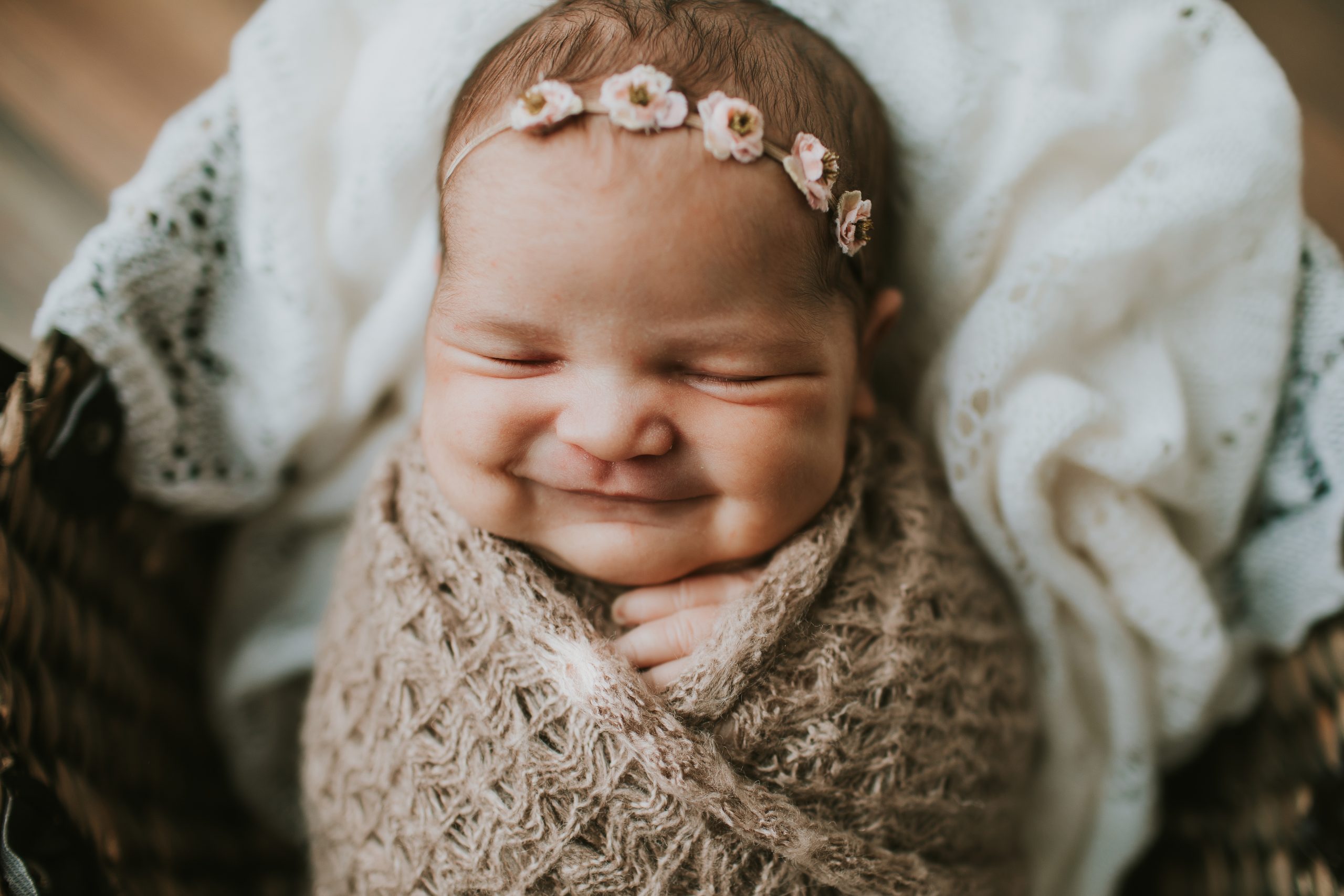 newborn smiling big