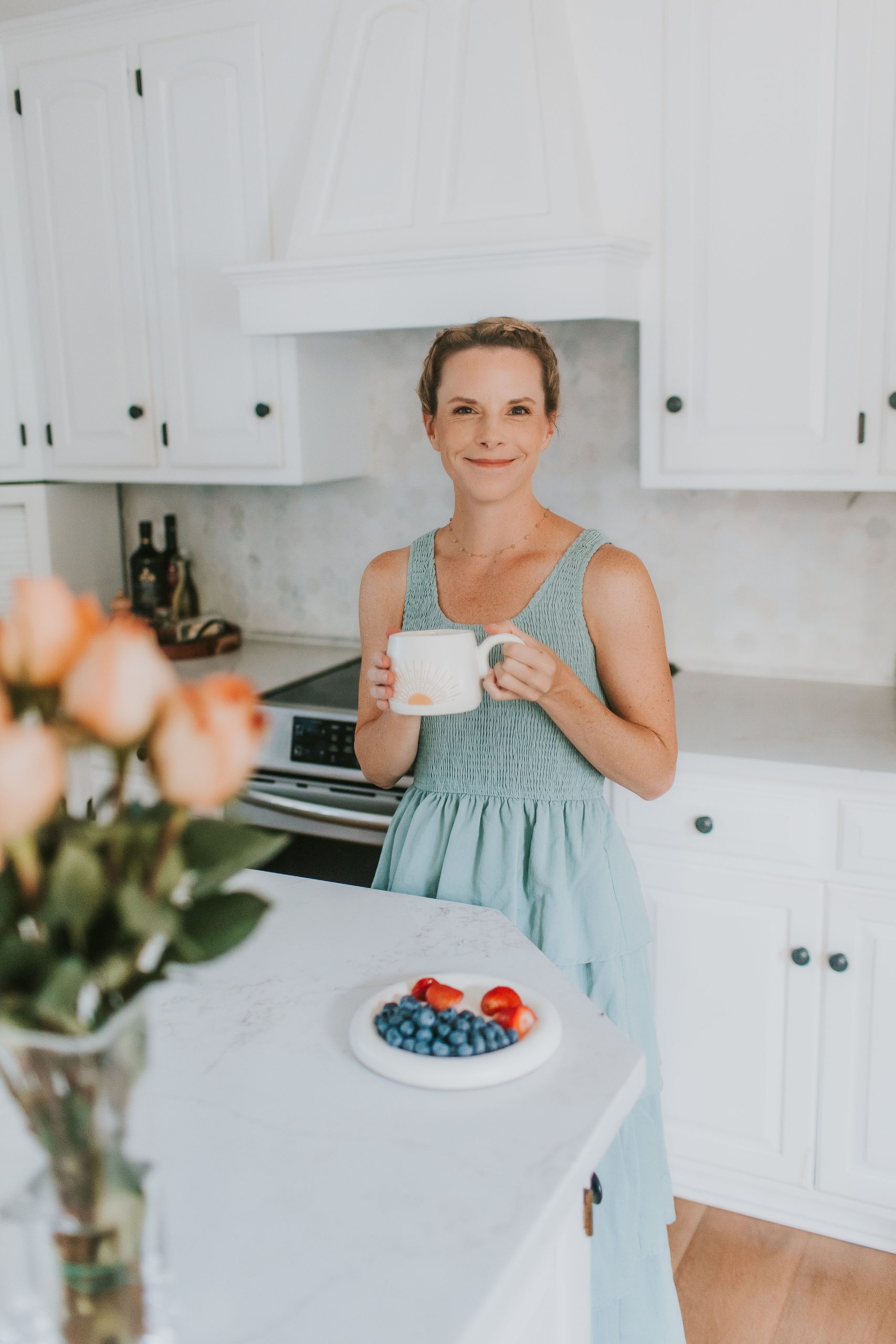 woman in kitchen with mug