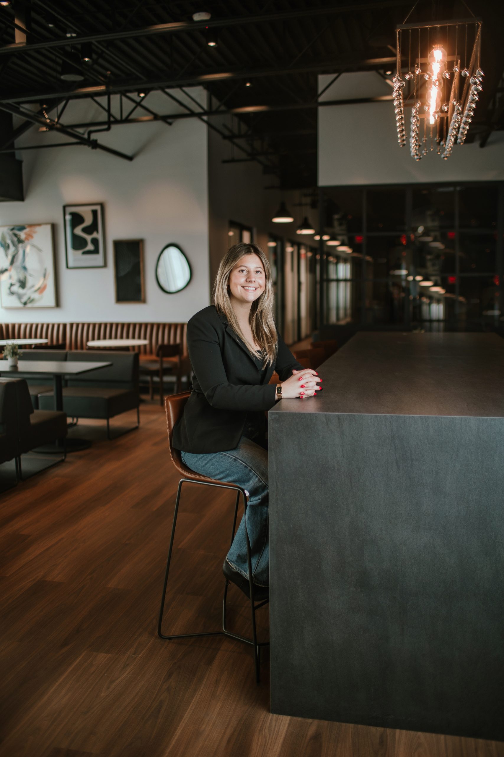 woman sitting at desk in huge elegant space