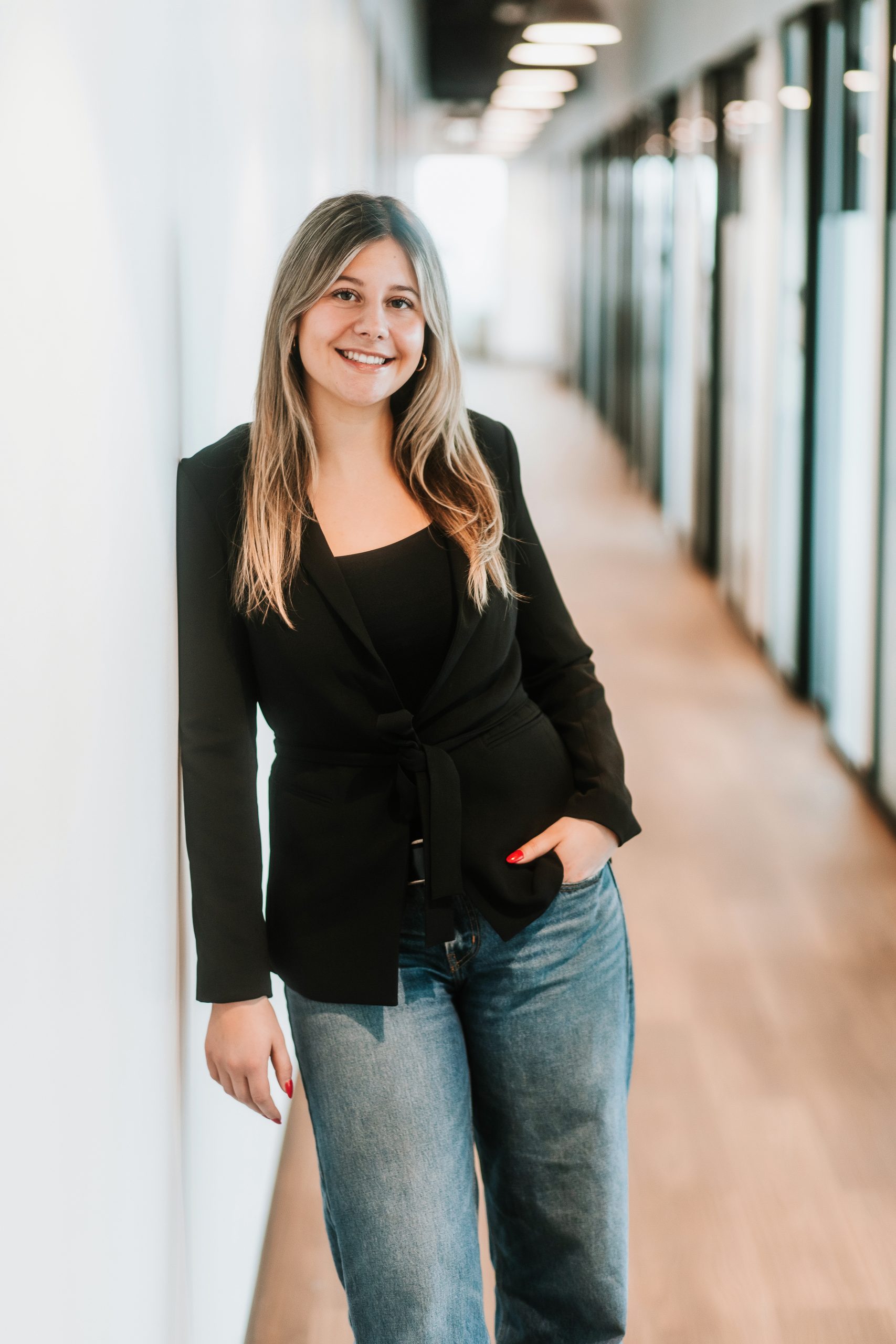 woman standing in long hallway