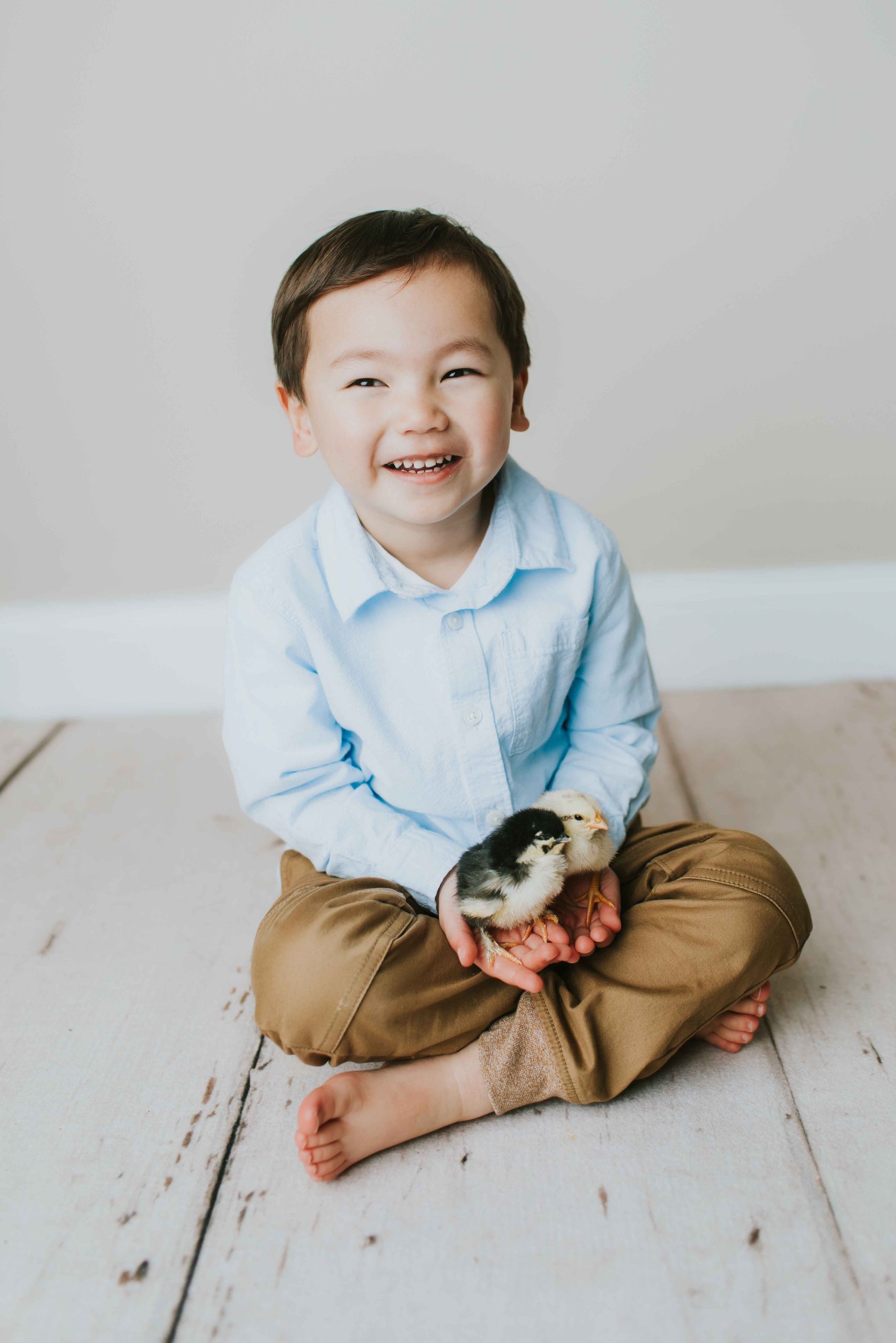 baby chick mini session boy smiling