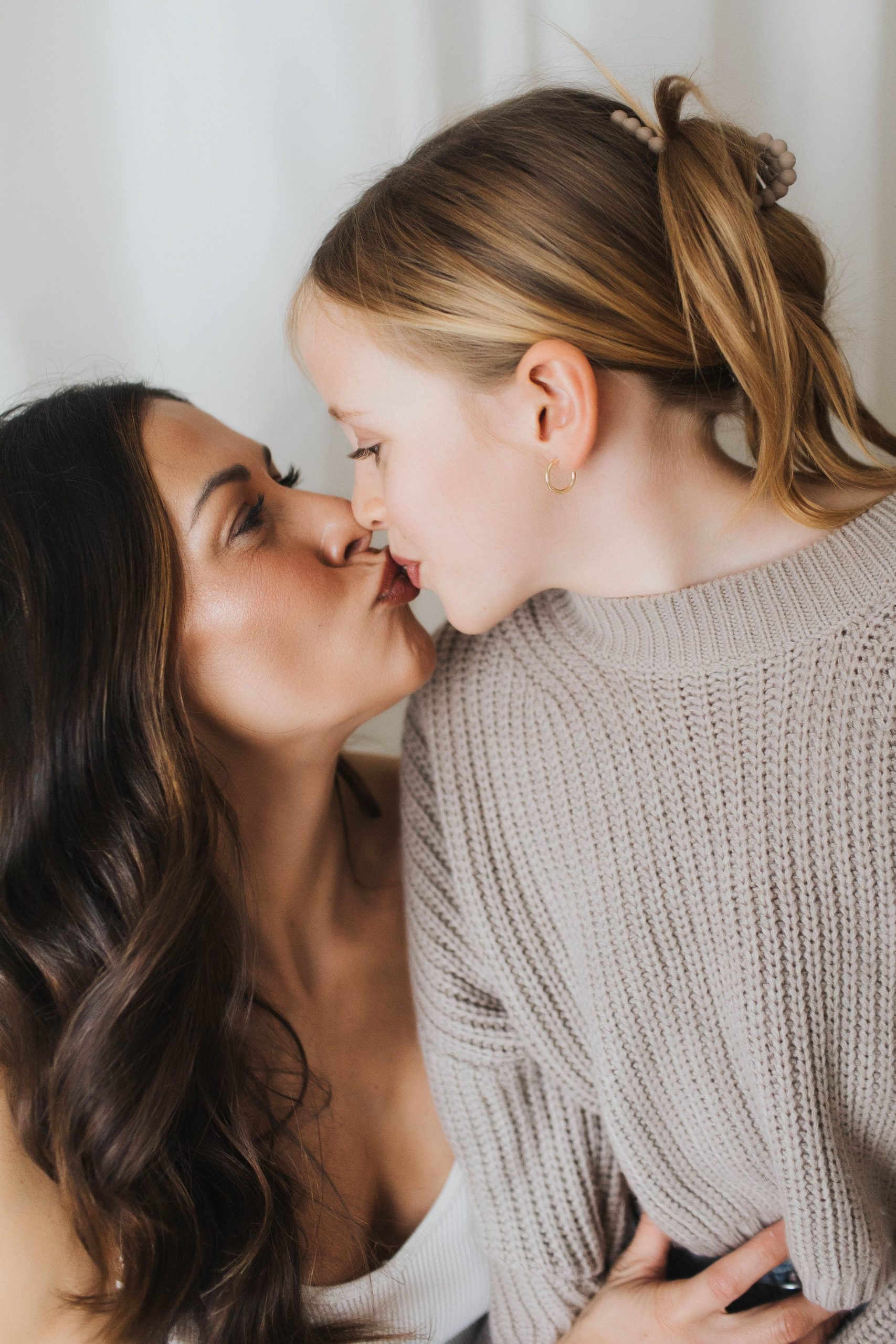 mom daughter kiss