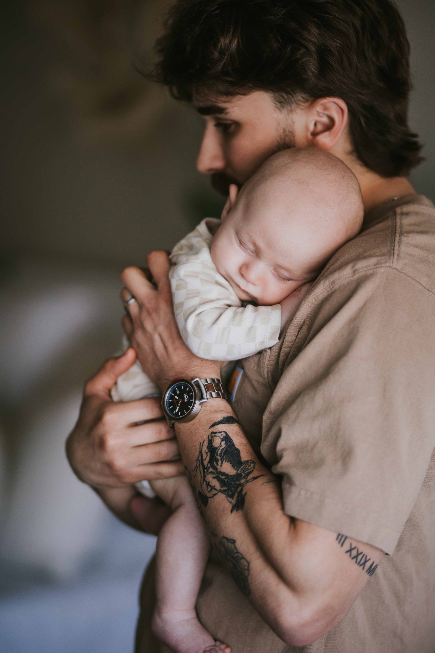 dad holding newborn son