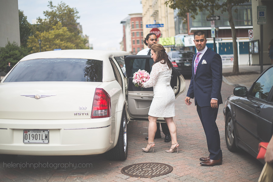 Bride and groom getting into a car after wedding