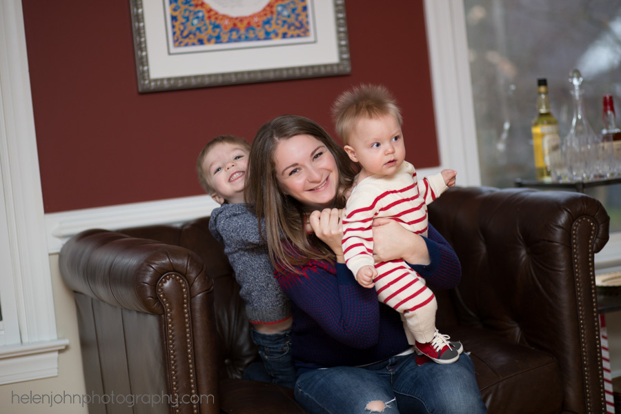 Mom and two sons in living room portrait