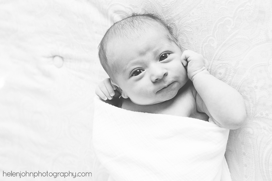 Black and white of newborn looking at camera