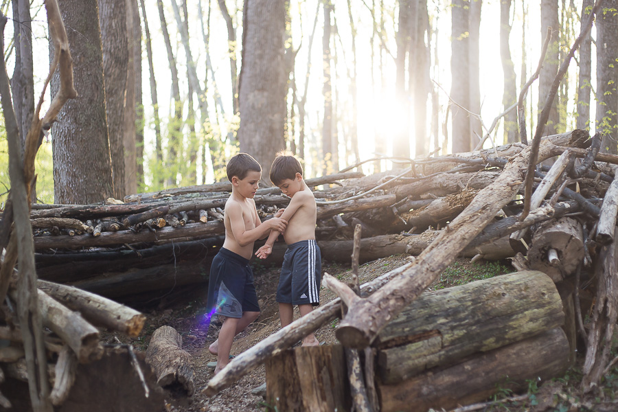 boys playing in woods