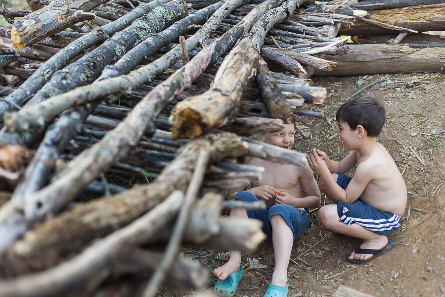 boys laughing in fort