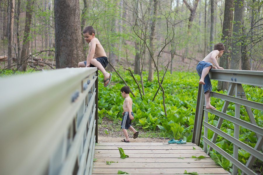 boys climbing bridge