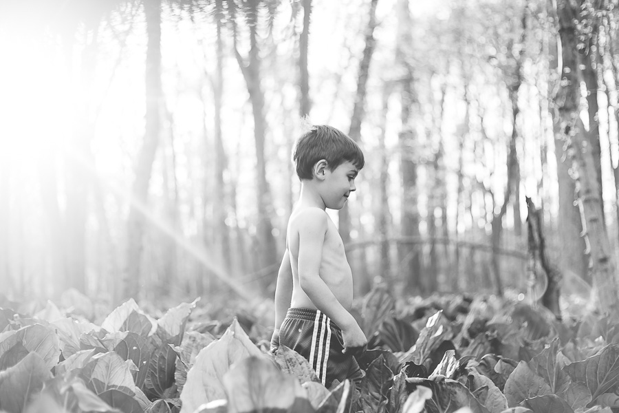 black and white photo of 4 year old boy walking