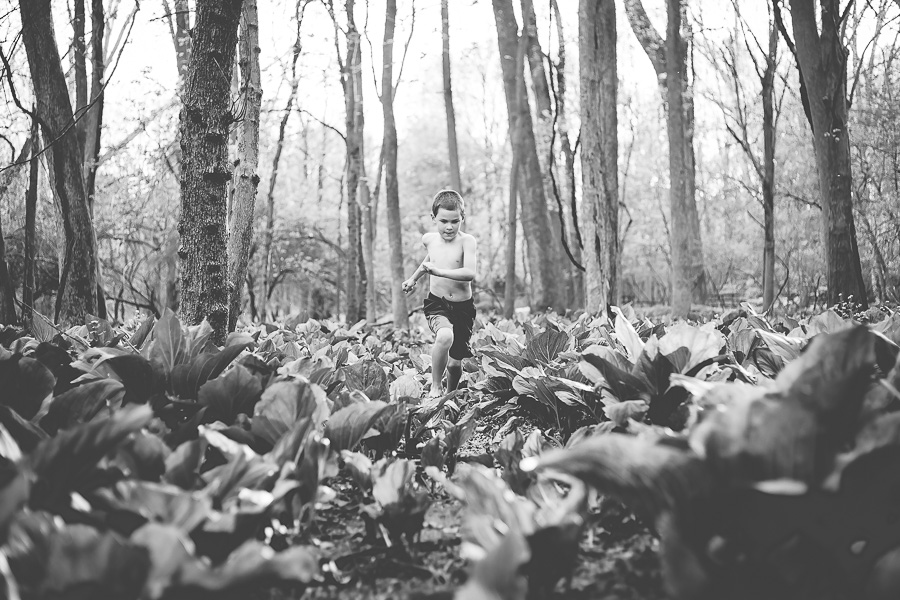 b&w of boy running