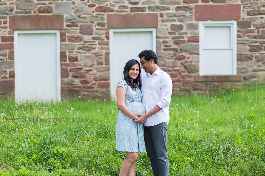 Married couple standing in front of brick building