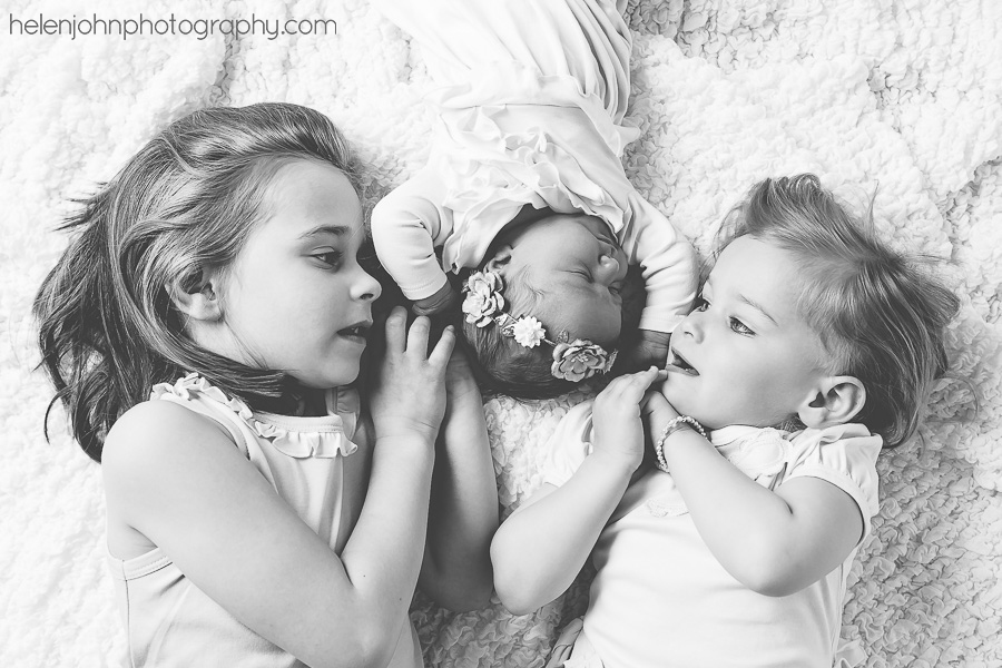 Newborn baby with older siblings
