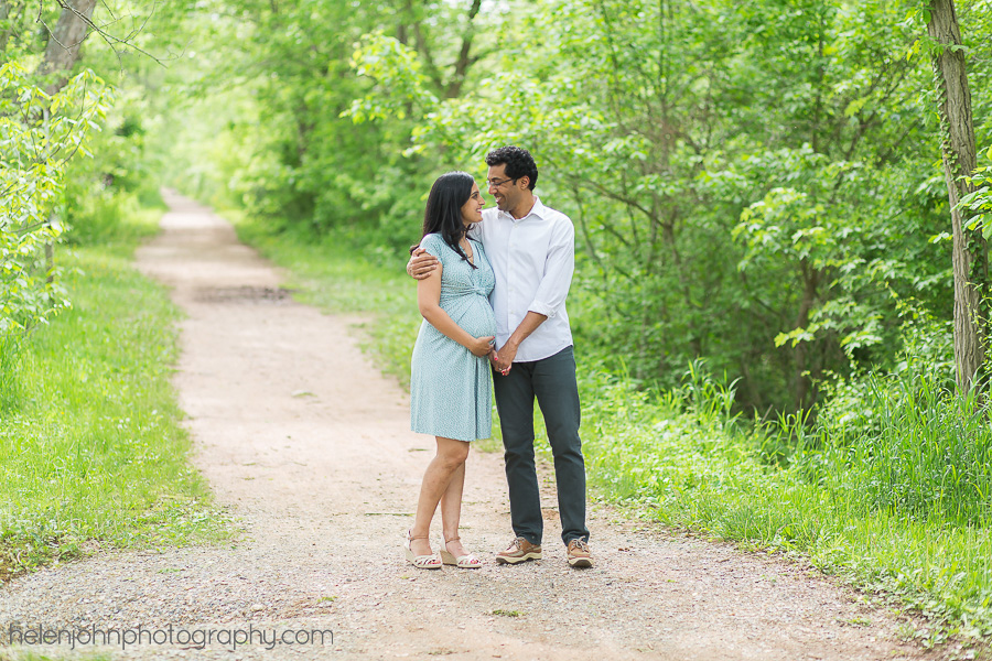Couple standing together on a dirt road