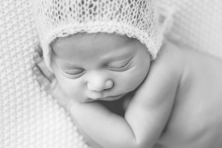 B&W close up of newborn in mohair bonnet 