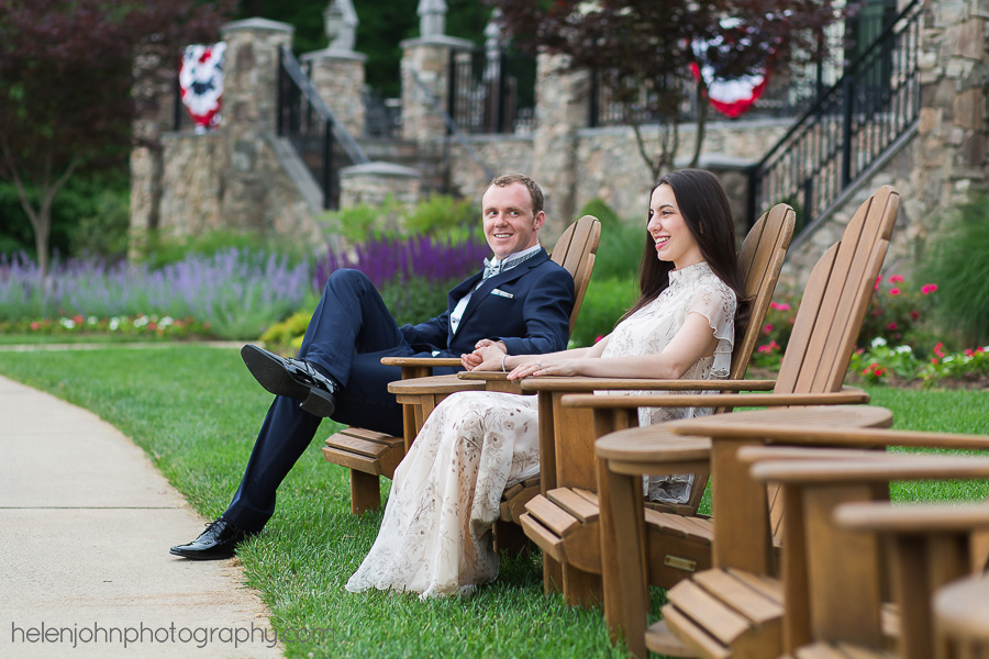 Engaged couple sitting together in wooden chairs