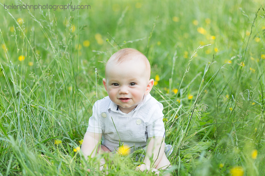 Little kid playing in the grass