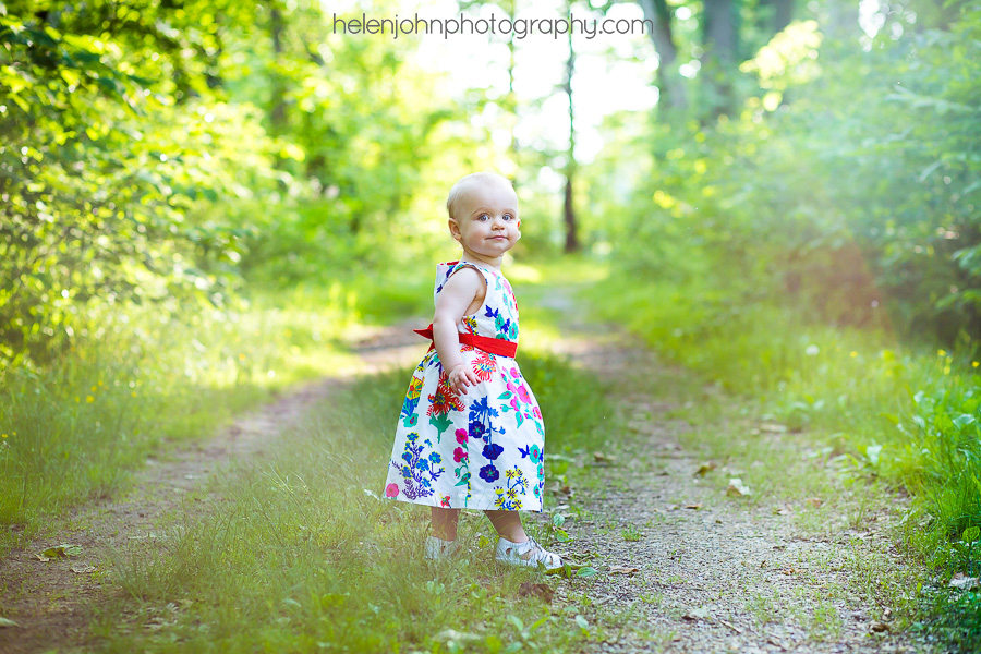 Little girl walking down a gravel road