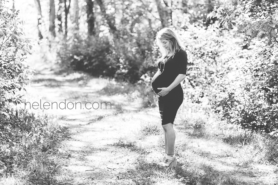 Maternity portrait of a lady standing outside