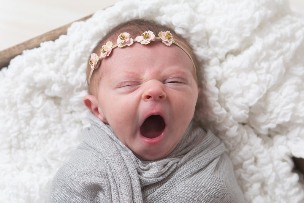 yawinging newborn baby girl