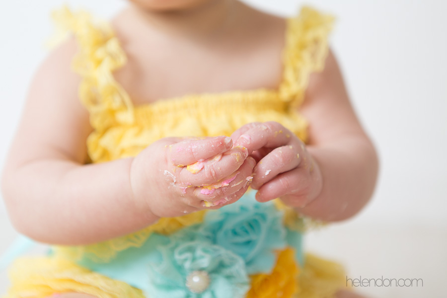 messy with cake baby girl hands 