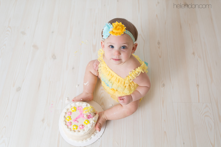 adorable baby girl cake smash smile