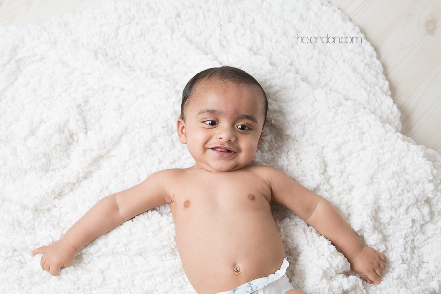 adorable baby lying on back smiling