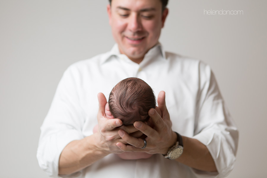 father holding newborn daughter