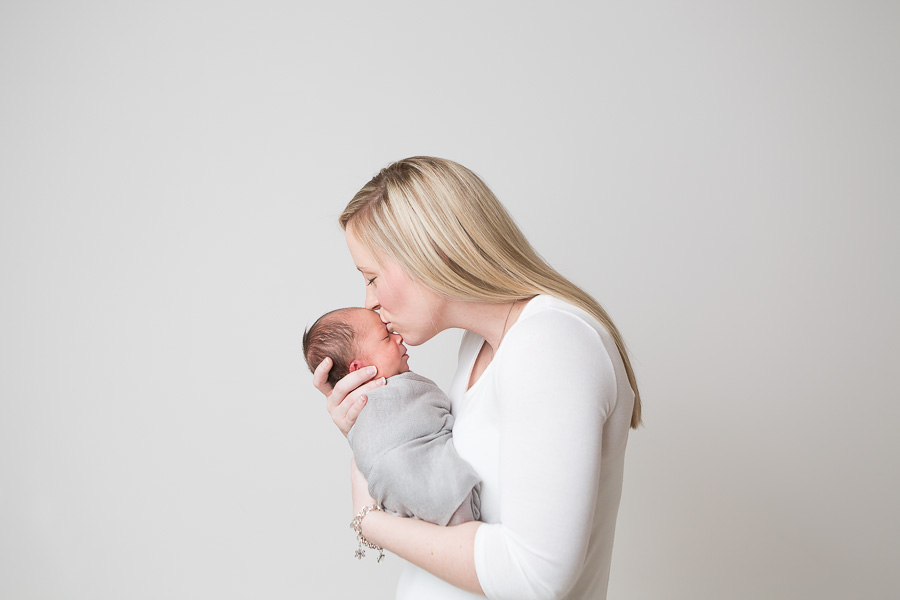 Rockville Mother Kisses Newborn Baby Son