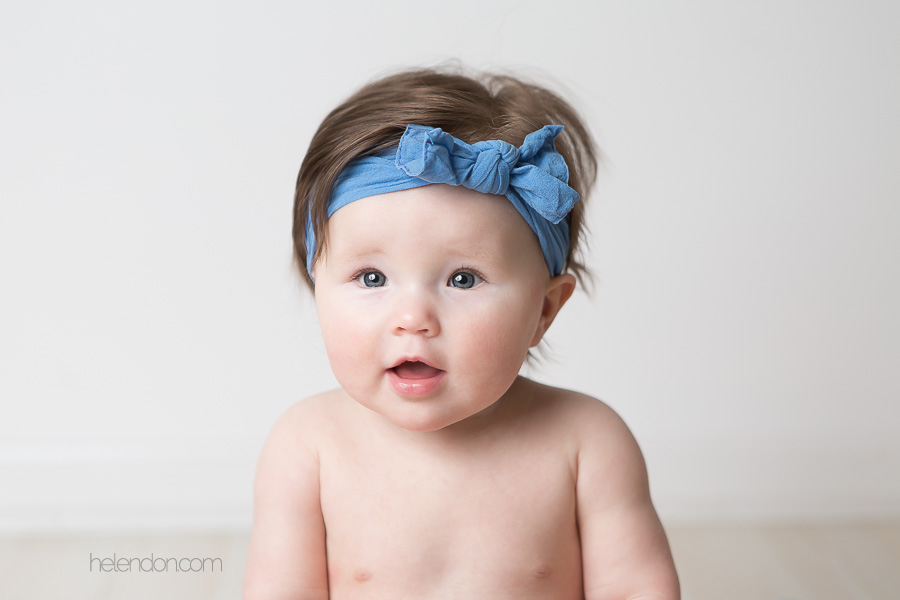 super cute baby girl with blue headband