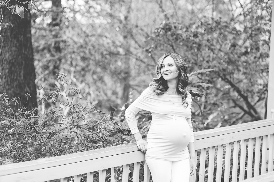 25 week pregnant mom laughing black and white image