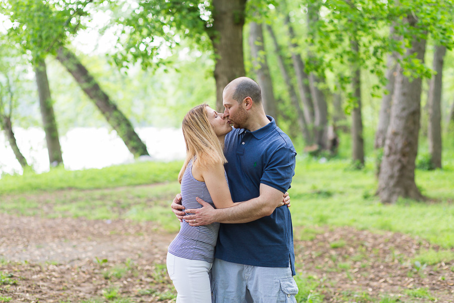 parents kissing in woods